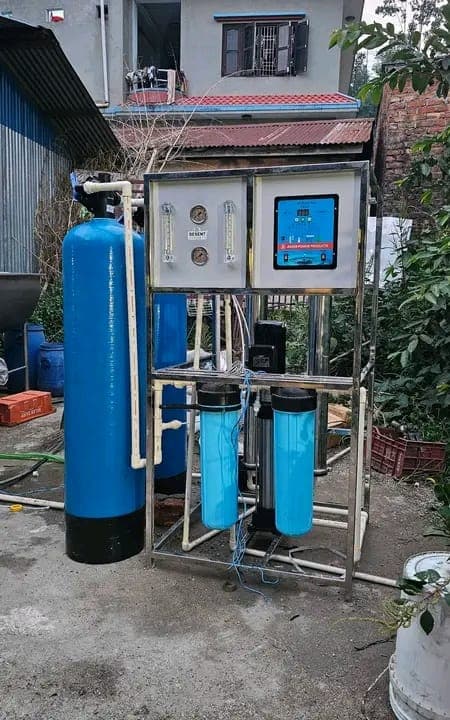Compact outdoor RO plant installation with softener vessel and control panel