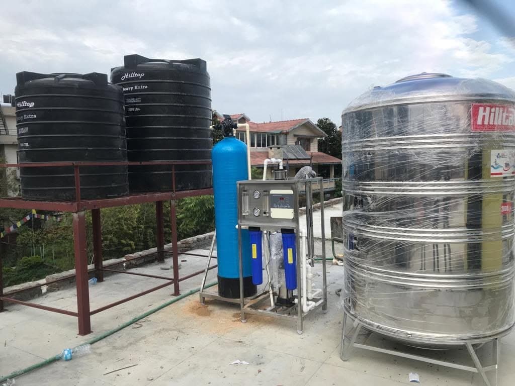 Rooftop water tank and treatment system installation